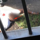 A photo of Jermaine McBean taken shortly after the July 13, 2013, police shooting that killed him appears to show McBean wearing earbuds (pointed out by red arrow). Police claim McBean’s earbuds were in his pocket at the time of the shooting.
NBC News Screenshot